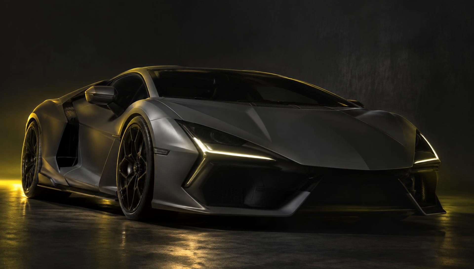Dark grey Lamborghini-style supercar under yellow studio light